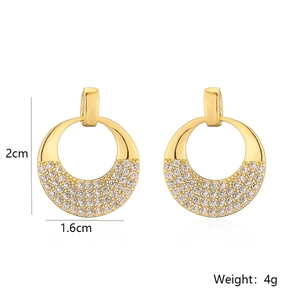 Macro detail of 18K gold plated earrings with zircon crystals and 2cm height dimensions