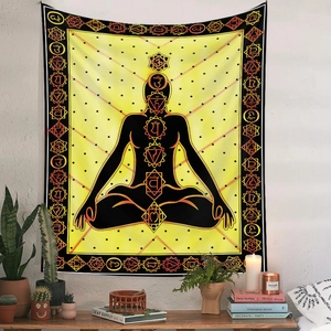 Detail of meditation tapestry showing chakra symbols and silhouette in a zen setting