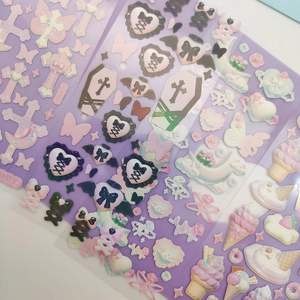 Detailed view of purple Gothic Y2K stickers with cross, heart and bow patterns