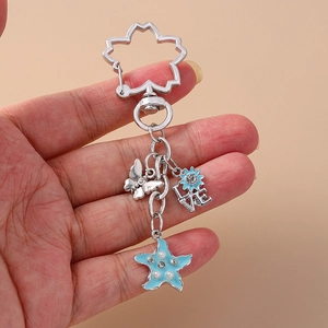 Silver keychain with blue enamel flower, butterfly, starfish and LOVE charm