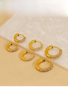 Detailed view of six 18K gold-plated titanium steel hoop earrings with crystal pavé setting