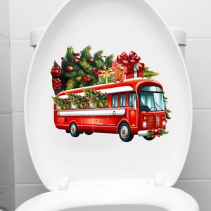 Close-up of a festive red Christmas bus sticker applied to a white toilet seat lid