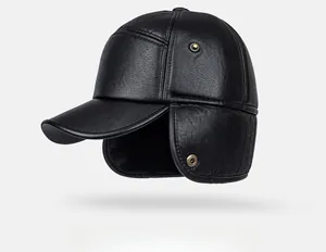 Detail view of winter leather cap featuring foldable ear flaps and lychee texture