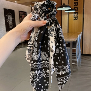 Fashionable paisley print hair scrunchie with long ribbons in black and white silk fabric