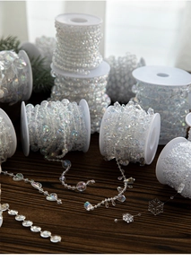 Iridescent acrylic bead garland with snowflake and heart shapes for Christmas decor