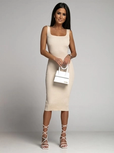 Close-up of beige ribbed knit fabric texture on a slim fit sleeveless midi dress