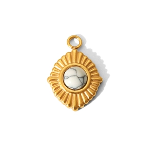 Macro view of gold stainless steel star pendant with white turquoise stone inlay