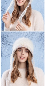 Close-up of white plush crochet hat with colorful polka dots and long tassels details