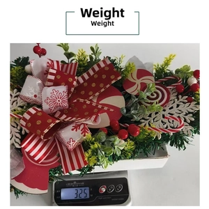 Detailed weight measurement of a Christmas candy teardrop swag showing 325g on a scale