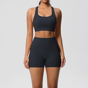 Front view of matte black two-piece sports bra and high-waisted shorts fitness set