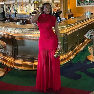Detail of red sleeveless maxi dress with high neck, waist pleats and draped hemline