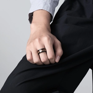 Men's wide stainless steel elk ring with wood inlay showcased on finger