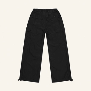 Rear view of black wide-leg cargo pants featuring elastic waist and drawstring hem detail