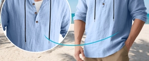 Detail of light blue linen shirt featuring drawstring neckline and wood buttons texture