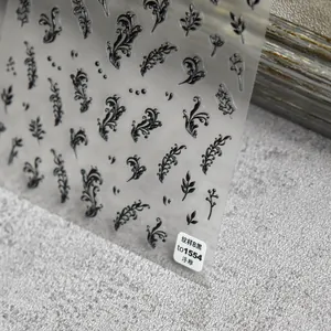 Macro detail of embossed black floral nail stickers with vintage pattern B and 3D texture
