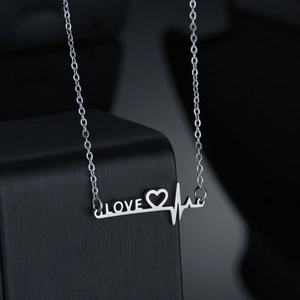 Modern silver stainless steel heartbeat necklace featuring LOVE letters and heart pendant