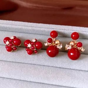 Retro 18K gold plated red bead stud earrings with crystals in a velvet jewelry box