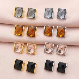 Detail of square glass stud earrings in multiple colors with 18K gold and silver plating