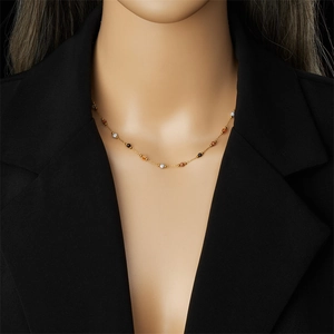 Gold-plated stainless steel chain necklace with colorful beads on a female model