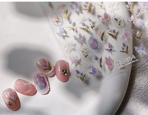 Detail of purple butterfly and tulip nail stickers with iridescent holographic texture