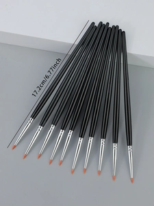Detailed view of 12pcs fine eyeliner brushes with orange tips and 17.2cm long black handles