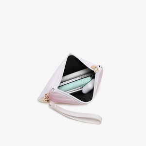 Rainbow gradient pink and white striped ladies wristlet bag with internal storage view