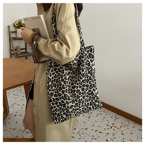Minimalist leopard print canvas tote bag shown with model for daily casual commute use