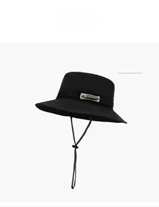 Detail of black quick-dry sun hat with adjustable drawstring and Natural Life label