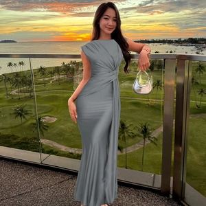 Detail of grey sleeveless maxi dress featuring a twisted waist knot and pleated design