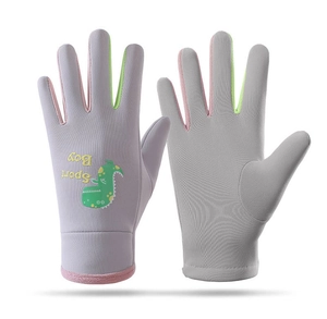 Detail showing grey kids skiing gloves with cute dinosaur pattern and Boy Sport text