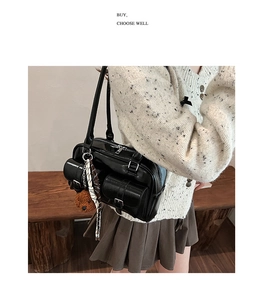 Chic black PU leather shoulder bag featuring multi-pocket design and a plush bear pendant