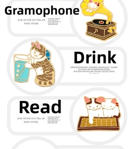 Detailed views of cat enamel pins featuring record player and reading kittens