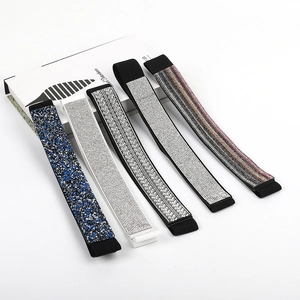 Sparkling rhinestone elastic waist belts in five varied designs on a white background