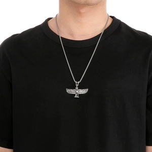 Detail of silver vintage angel wing pendant necklace on model with Egyptian goddess design