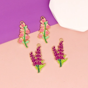 Detailed macro view of pink and purple enamel lavender flower pendants with gold plating