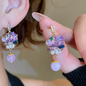 Bohemian crystal tassel earrings with gold floral design and purple beads