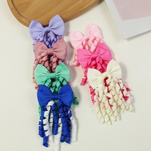 Set of colorful grosgrain ribbon hair bows with long curly streamers for girls