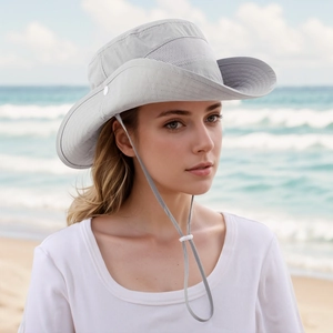 Detail of light grey sun hat with breathable mesh top and adjustable chin strap