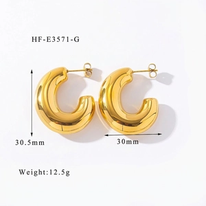 Macro detail of chunky gold hoop earrings with dimensions 30.5mm by 30mm and weight 12.5g