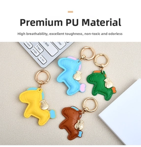 Detail of horse-shaped PU leather keychains in four colors with durable gold rings