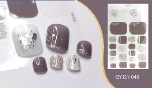 Detail of purple-grey toe nail stickers with silver glitter and foil accents, model QYJ21-048