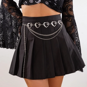 Punk style silver heart metal body chain with layered tassels on black pleated skirt
