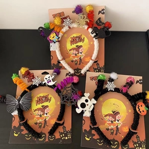 Detail of Halloween headbands featuring ghost, spider, and pumpkin festive elements