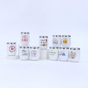 Multiple 12oz stainless steel wine tumblers with white matte finish and cartoon designs