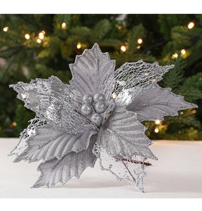 Close-up of silver artificial poinsettia with glitter petals for Christmas tree decor