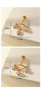 Macro view of gold F136 titanium piercing studs featuring dangling zircon chain details
