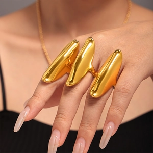 Minimalist gold-plated irregular triple finger ring featuring a polished metallic finish