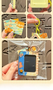 Detailed views of cartoon capybara keychain with metal clasp and original backing card
