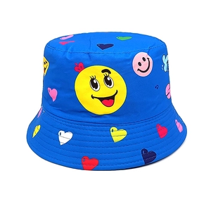 Detail of blue canvas sun hat featuring cartoon smiley face prints and reinforced stitching