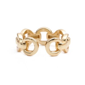 Detail of adjustable gold chain ring showing brushed metal texture and zircon inlay